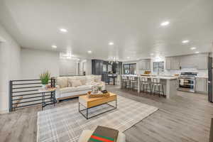 Living room with light hardwood / wood-style floors