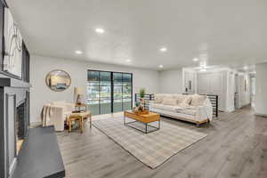 Living room with light hardwood / wood-style floors