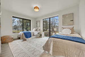 Bedroom with light hardwood / wood-style floors