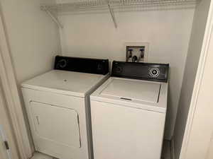 Clothes washing area with washer and clothes dryer