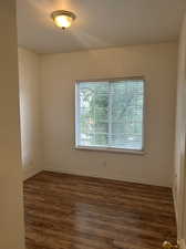 Unfurnished room with hardwood / wood-style floors