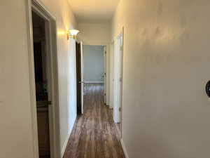 Corridor with dark wood-type flooring