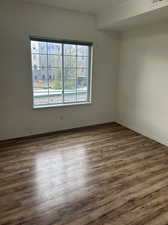 Unfurnished room featuring wood-type flooring