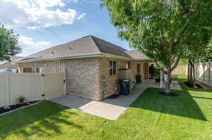 Back of house featuring a patio and a yard