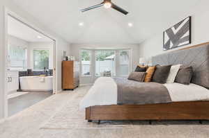 Bedroom featuring ceiling fan, light tile patterned flooring, and high vaulted ceiling