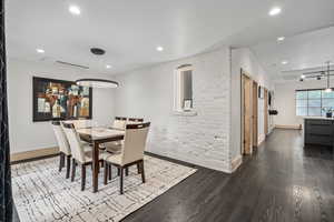 Dining area with hardwood / wood-style flooring