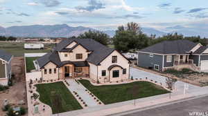 View of front facade with a front yard and a mountain view