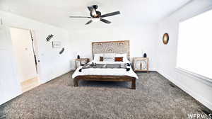 Bedroom featuring ceiling fan and carpet floors