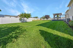 View of yard featuring a pergola