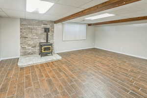 Basement family room with wood burning stove.