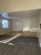 Wood-type flooring in the dining area with natural light