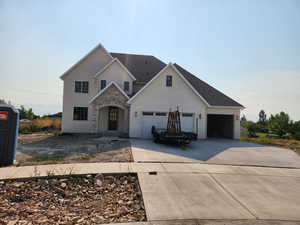 View of front of house with a garage