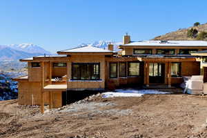 Back of house with a mountain view