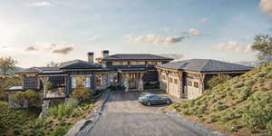 Prairie-style house with a carport and a garage