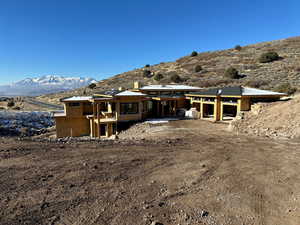 Back of property featuring a mountain view