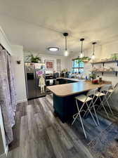 Kitchen with breakfast bar and pantry