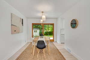 Dining area featuring light wood-type flooring