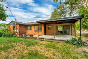 Back of house featuring central AC