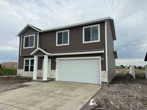 View of front of home featuring a garage