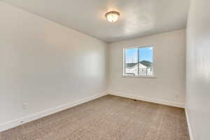 View of carpeted spare room