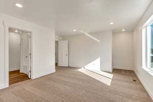 Unfurnished room featuring carpet