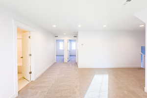 Unfurnished room featuring light colored carpet