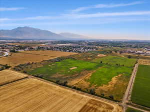 Birds eye view of property with a rural view and a mountain view