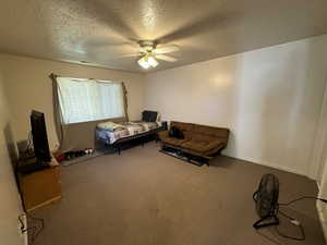 Primary bedroom with ceiling fan