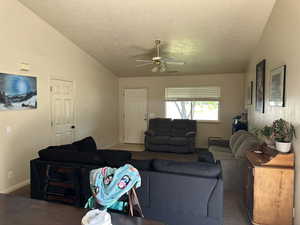 Family room featuring  high vaulted ceiling, and ceiling fan