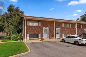 Brick exterior with two private parking stalls.