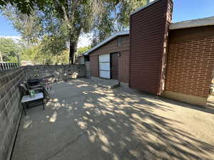 Large Patio on side of house with door to kitchen