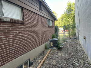 View of side of home featuring central air condition unit