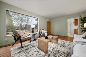 Living room with light hardwood / wood-style flooring