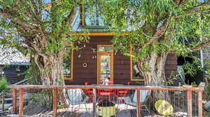 Entrance to property featuring a wooden deck