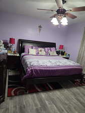 Bedroom #1 with ceiling fan and wood-type flooring