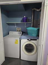 Laundry room featuring washing machine and dryer