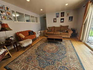 Living room with light hardwood / wood-style floors