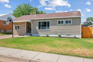 View of front of house with a front yard