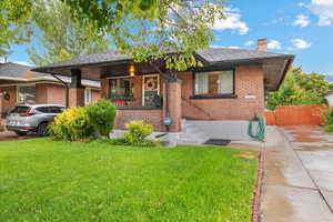 Front view of home showing long concrete driveway