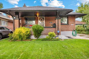 West facing front view of home featuring covered porch