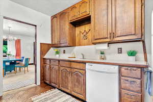 Kitchen with view of dining area.  Plenty of storage sapce with wood cabnets that go all the way to the ceiling