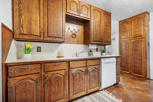 Kitchen featuring a view of additional storage cabinets