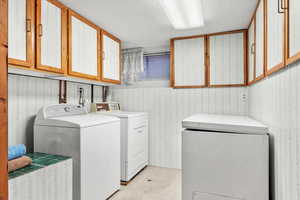 Spacious Laundry Room with food storage area and chest freezer included in sale.