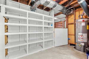 Custom built storage shelves located in the spacious laundry/storage area