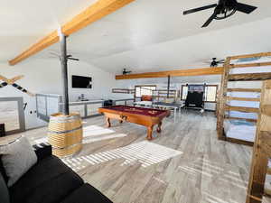 Recreation room with pool table, vaulted ceiling with beams, wood-type flooring, and ceiling fan