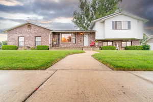 Tri-level home with a lawn