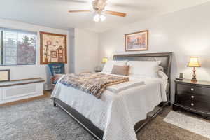 Bedroom with ceiling fan and carpet flooring