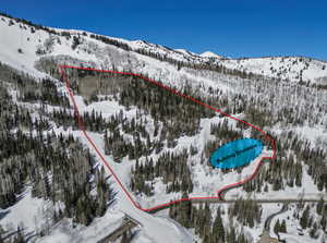 Snowy aerial view with a mountain view