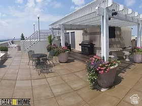 View of patio with a pergola and grilling area