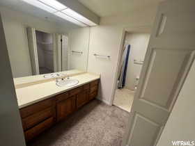 Bathroom with vanity and tile patterned flooring